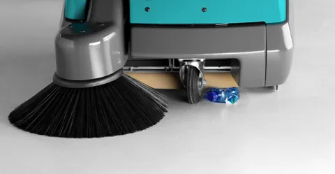 Walk-behind sweeper with flap lift device