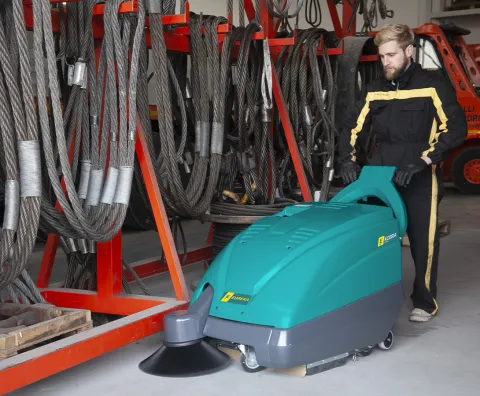 Walk-behind sweeper for cleaning the warehouse