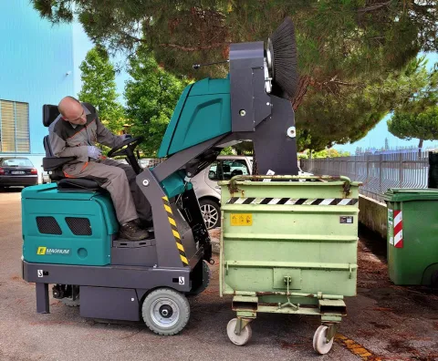 Magnum industrial sweeper with high-reaching waste discharge system